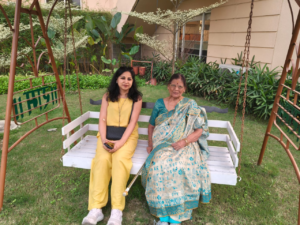A family enjoys quality time on a garden swing at Jagriti Stays during a Durga Puja Staycation in Kolkata.